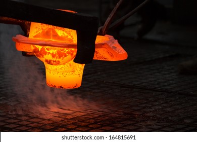 A Glowing Iron Ingot On The Floor