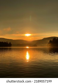 Glowing Lake Sunset Over Blue Mountain In The Adirondacks.