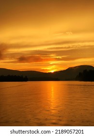 Glowing Lake Sunset Over Blue Mountain In The Adirondacks.