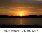 Glowing Lakeside Sunset Sunrise with Mountains in West Texas