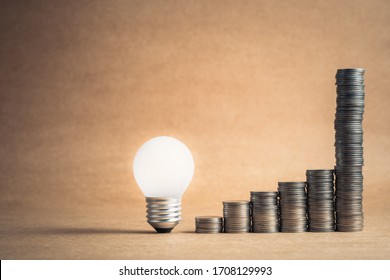 Glowing light bulb with heap coins stair that sudden steep higher progress in the last step, high earnings or success in the long term for finance and business concept
