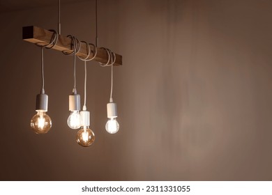 Glowing light bulbs in dark room - Powered by Shutterstock