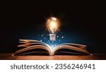 Glowing lightbulb over a book, Inspiring from read concept, Education knowledge and business education ideas, Innovations, self-learning, knowledge and searching for new ideas. Thinking for new idea.