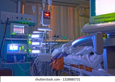 Glowing Monitors In Intensive Care Department. Nigth Shift At Icu, Patient In Critical State.