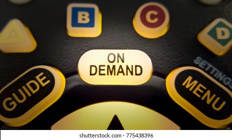 Glowing On Demand tv remote control button - Shutterstock ID 775438396