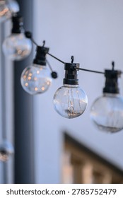 Glowing outdoor string lights creating soft evening ambience