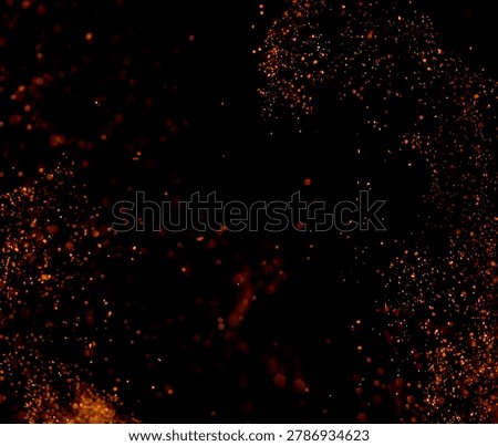Glowing particles float against deep black background. Particles shimmer with warm, orange light. They drift randomly, creating abstract motion. Perfect for backgrounds, bokeh effects