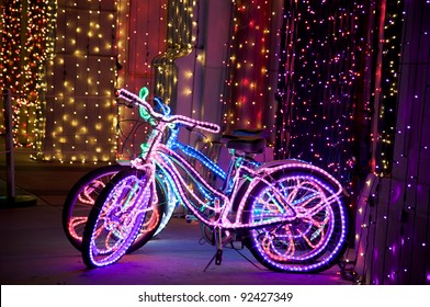 Glowing psychedelic bikes with multicolored Christmas lights