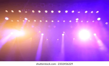 glowing purple atmospheric abstract background of concert spotlights with light and Mist during the show or concert - Shutterstock ID 2332456229