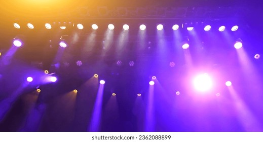 glowing purple atmospheric abstract background of concert spotlights with light and Mist during the show or concert - Shutterstock ID 2362088899