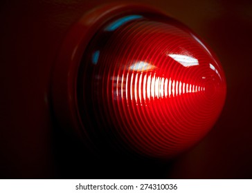 A Glowing Red Emergency Light.