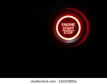 glowing red engine start stop light and black background - Powered by Shutterstock - Get 15% off with code: PIKWIZARD15