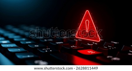 A glowing red warning triangle hovers over a keyboard, signaling a cyber attack. The dramatic lighting enhances the sense of urgent danger.