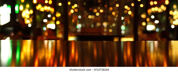 Glowing Reflection Of Party Light On Wood Table In Pub Or Bar In Christmas Night Banner Background