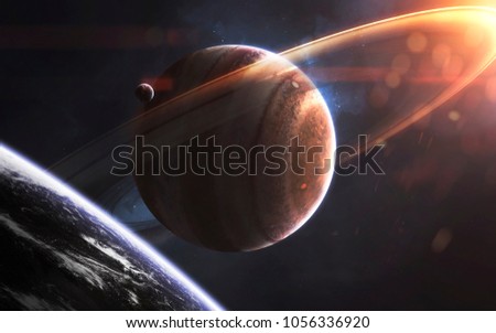 Glowing rings of gas giant, awesome science fiction wallpaper, cosmic landscape. Elements of this image furnished by NASA