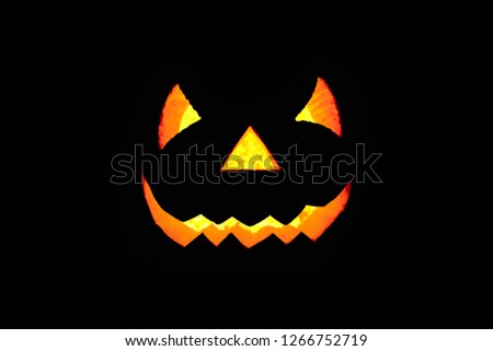 Similar – Image, Stock Photo Creepy carved Halloween pumpkin next to burning candle