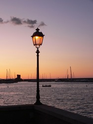 Glowing Street Lamp On Mediterranean Sunset
