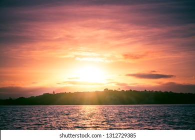 Glowing Sunset Over Calm Bay Waters Stock Photo 1312729385 | Shutterstock