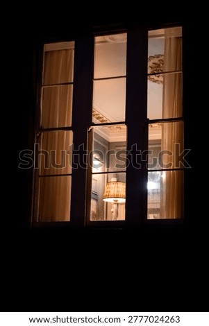 Glowing Windows with Curtains at Night, Warm and Safe Home Atmosphere	

