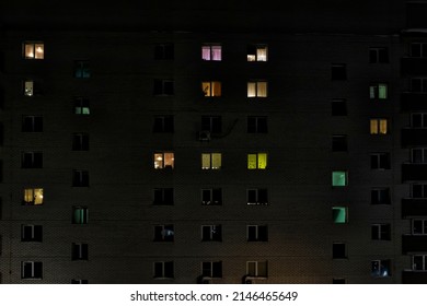 Glowing Windows Of A Residential Apartment Building At Night