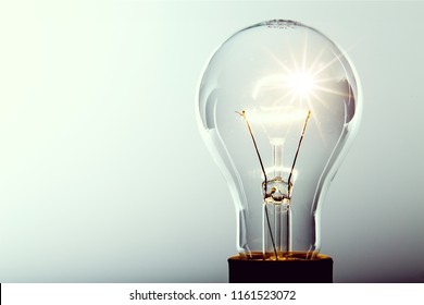 Glowing Yellow Light Bulb, Busienss Idea Concept