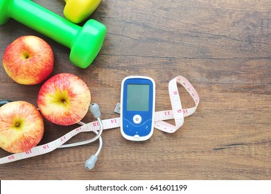 Glucose meter and Diabetes control with exercise concept. - Powered by Shutterstock