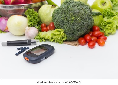 Glucose meter with  fresh  raw vegetables and fruits , desk of healthy organic vegetables, concept for healthy eating and diabetes. - Powered by Shutterstock