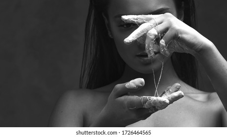 Glued hands, weakness and confusion in problems, concept. Beautiful young woman, emotional black and white portrait