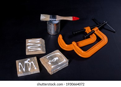 Gluing Pieces Of Wood With Carpentry Glue. Carpentry Work In A Home Workshop. Dark Background.