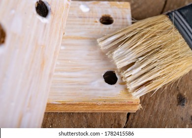 Gluing Wood With Carpentry Glue. Minor Carpentry Work In A Home Workshop. Light Background.