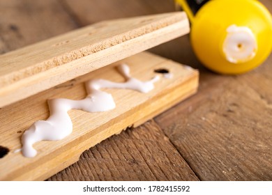 Gluing Wood With Carpentry Glue. Minor Carpentry Work In A Home Workshop. Light Background.