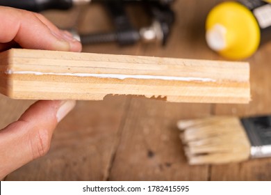 Gluing Wood With Carpentry Glue. Minor Carpentry Work In A Home Workshop. Light Background.