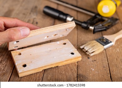 Gluing Wood With Carpentry Glue. Minor Carpentry Work In A Home Workshop. Light Background.