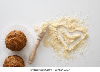 Gluten Free Baked Goods, Muffins On Almond Flour With Nuts On A White Background, Love Heart Symbol, Keto Food, Top View