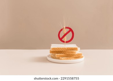 Gluten free bread on beige background with symbol crossed sprinkle. Gluten free concept. - Shutterstock ID 2291558755