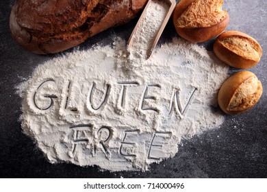 Gluten Free Breads, Glutenfree Word Written And Bread Rolls On Grey Background