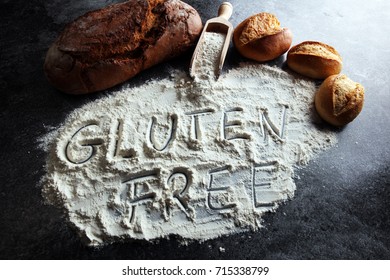 Gluten Free Breads, Glutenfree Word Written And Bread Rolls On Grey Background