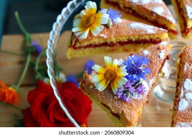 Gluten free cake with rasperry jam and edible flowers