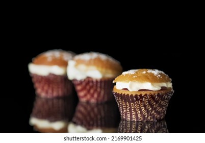 Gluten Free Muffin With Cream On Black Background