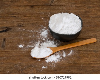 Gluten Free Potato Starch With Spoon,messy. Rustic Wooden Worktop.