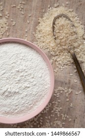 Gluten Free Rice Flour In A Pink Bowl, Overhead View. Flat Lay, Top View, From Above. Closeup.