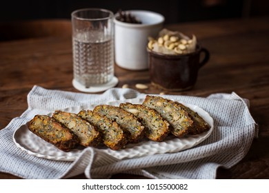 Gluten free sliced bread with nuts on wooden table - Shutterstock ID 1015500082