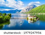 Gmunden Schloss Ort or Schloss Orth on the Traunsee lake aerial panoramic view, Austria. Gmunden Schloss Ort is an Austrian castle founded around 1080 year.