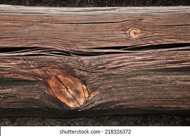 Gnarled Wooden Beam Wall Of An Old Building Close 