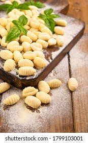 Gnocchi With Potatoes. Traditional Italian Food From Rome, Sardinia, South Of Italy. Homemade Gnocchi With Parmesan, Egg, Cornmeal (semolina). On A Wooden Table. High Quality Photo. Copy Space 