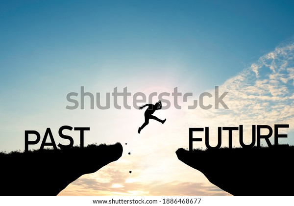 Go\
ahead and continuously improvement concept, silhouette man jump on\
a cliff from past to future with cloud sky\
background.