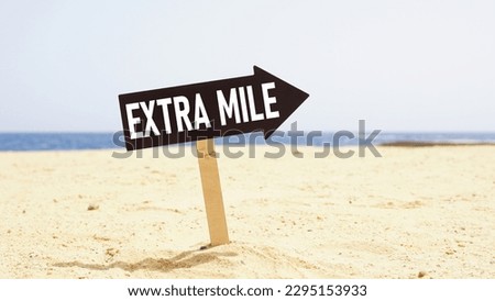 Go the extra mile is shown using the text on a road sign