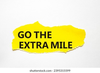Go the extra mile symbol. Torn yellow paper with words Go the extra mile. Beautiful white background. Business and Go the extra mile concept. Copy space. - Shutterstock ID 2395315599