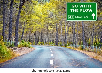 GO WITH THE FLOW Road Sign Against Clear Blue Sky