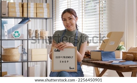 Go green vendor use eco care packaging box in net zero waste store asian seller retail home office shop. Small SME owner young adult woman asia Gen Z people happy relax smile pride looking at camera.